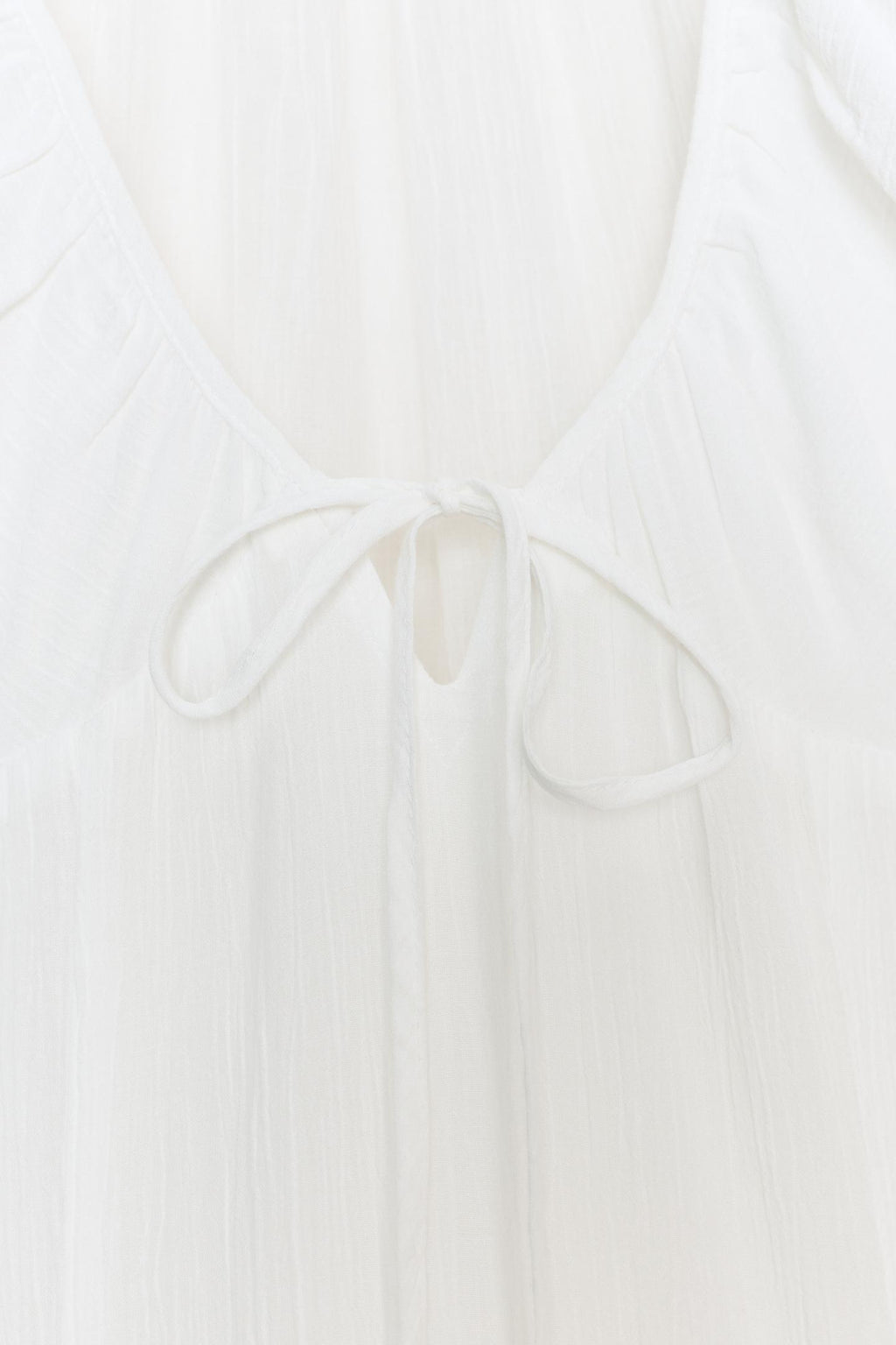 Robe mi-longue en gaze avec godets blanc
