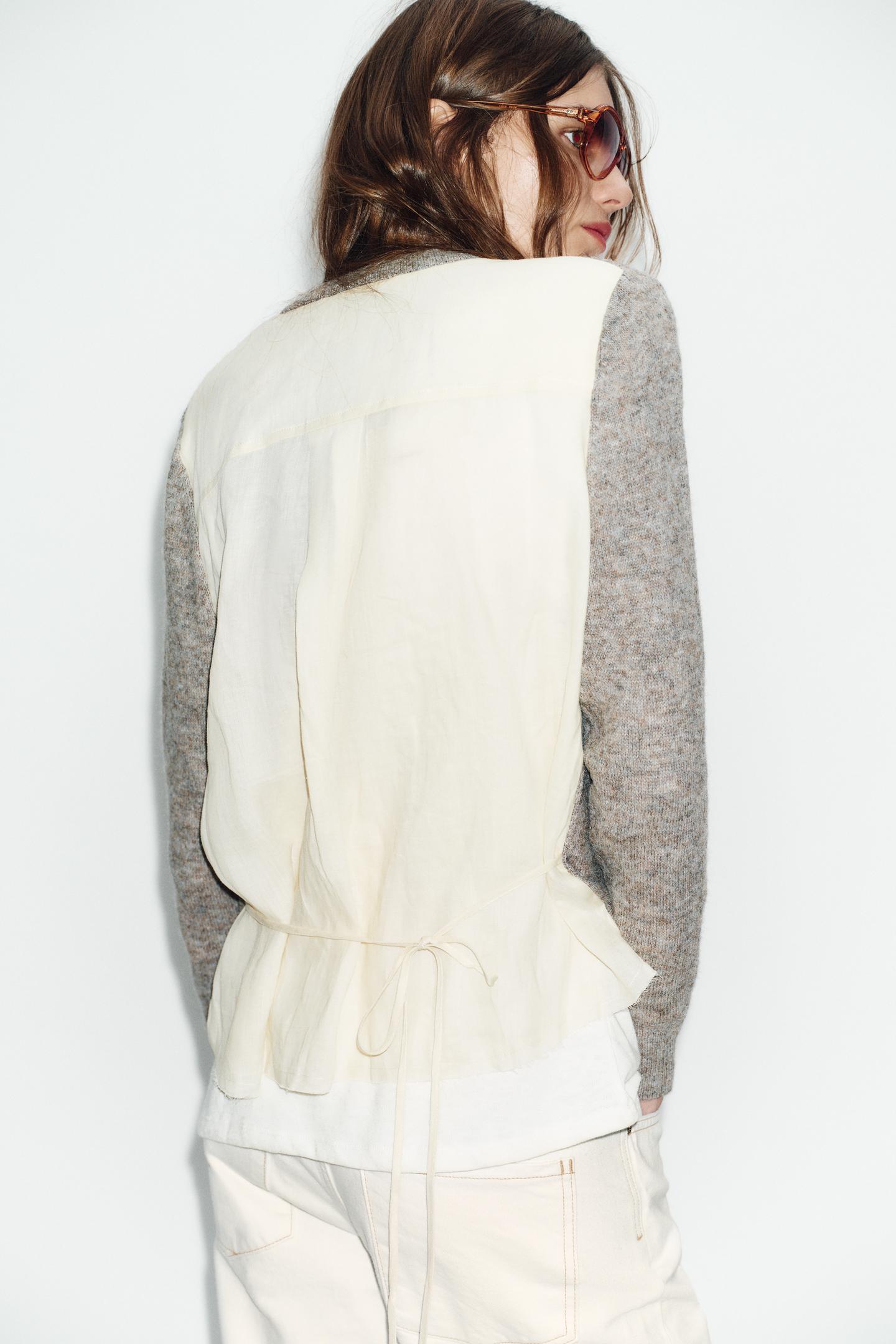 GILET EN MAILLE BIMATIÈRE AVEC CEINTURE