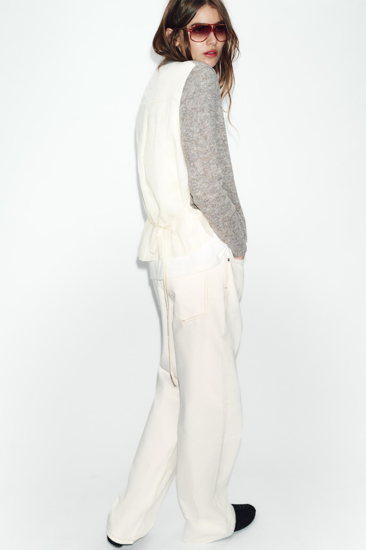 GILET EN MAILLE BIMATIÈRE AVEC CEINTURE