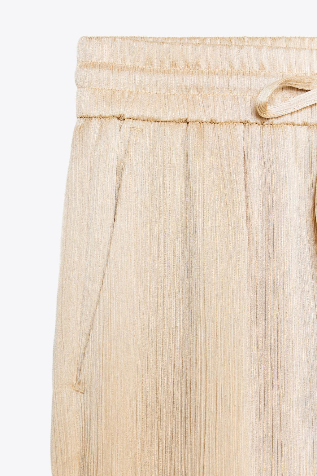 WEITE HOSE MIT FLUIDER SILHOUETTE IN BEIGE